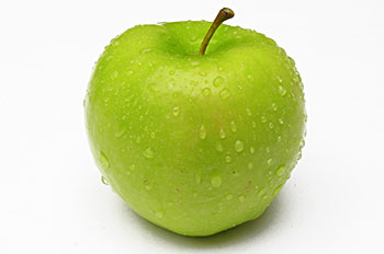 a green apple sprinkled with water