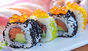 Sushi roll of raw salmon and avocado