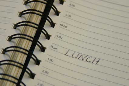 the word 'lunch' written in a daily planner book