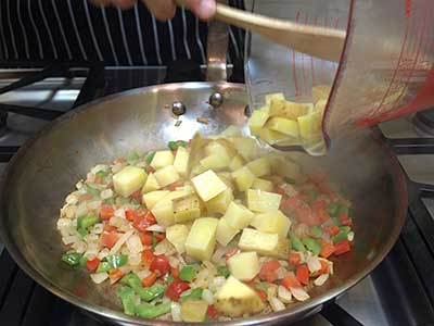 Add the potatoes. Toss to blend well with the other ingredients.