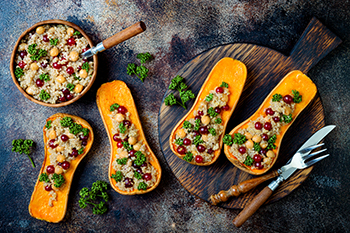 butternut squash stuffed with quinoa, cranberries, and greens