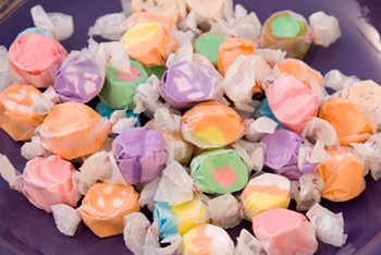 Taffy candies individually wrapped in waxed paper
