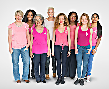 an ethnically- and body-type-diverse group of women wearing pink ribbons