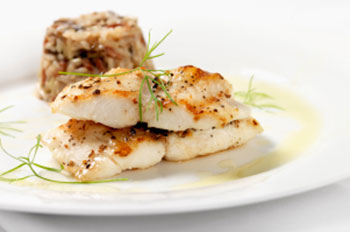 filets of roasted cod with a side of risotto