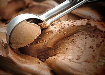 Chocolate Ice Cream being scooped with an ice cream scoop